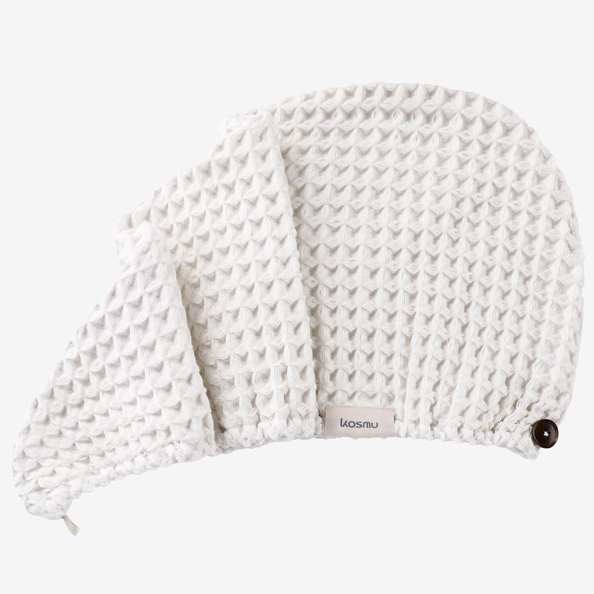 Kosmu hair wrap button closure demonstrates natural materials and easy secure fit.