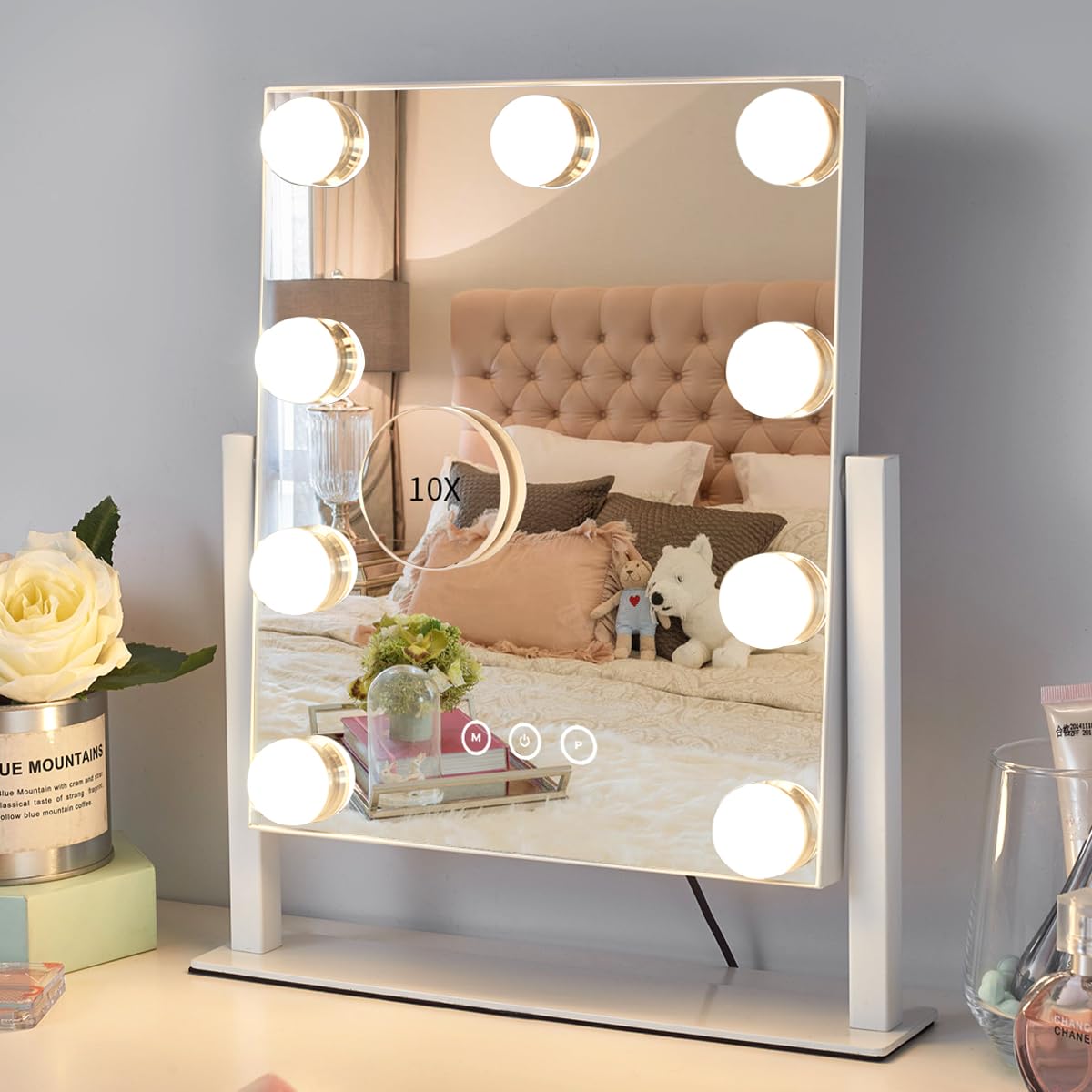 Kotdning vanity mirror with nine dimmable bulbs for even makeup lighting.