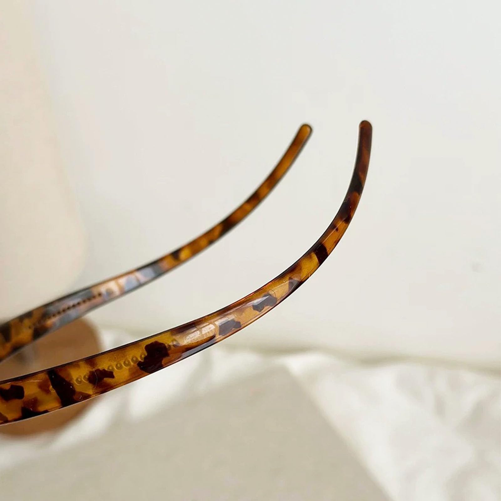 KOVOLITU leopard headband dimensions image confirms compact 12x15 cm size.