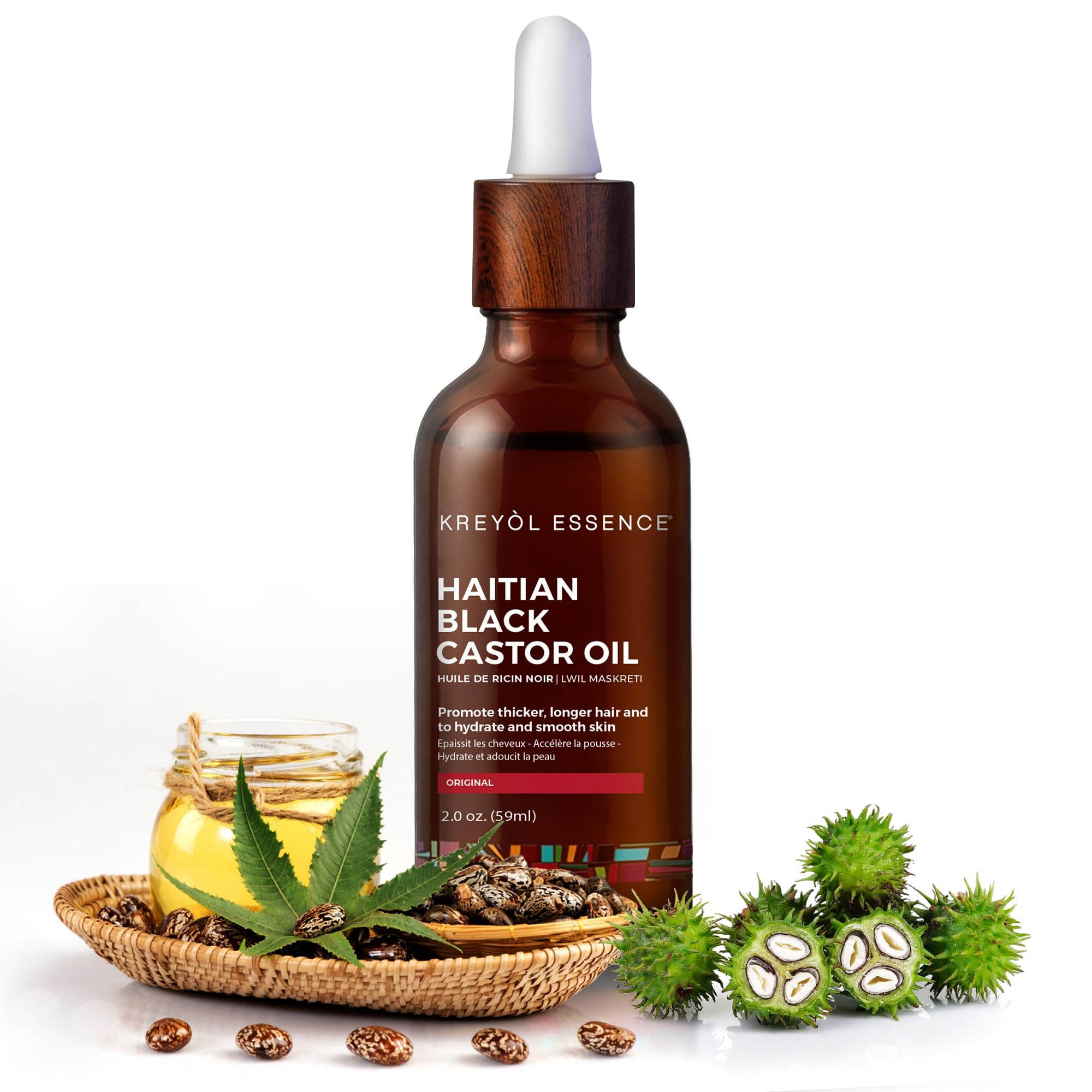Kreyol Essence bottle label closeup—high-quality oil for scalp moisturization and lustrous hair.