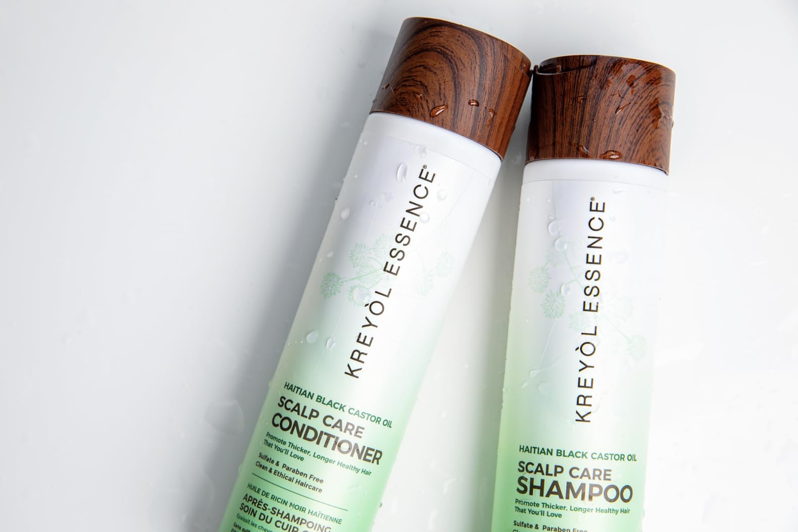 Kreyol Essence Coconut Oil application emphasizes deep moisturization and slip.