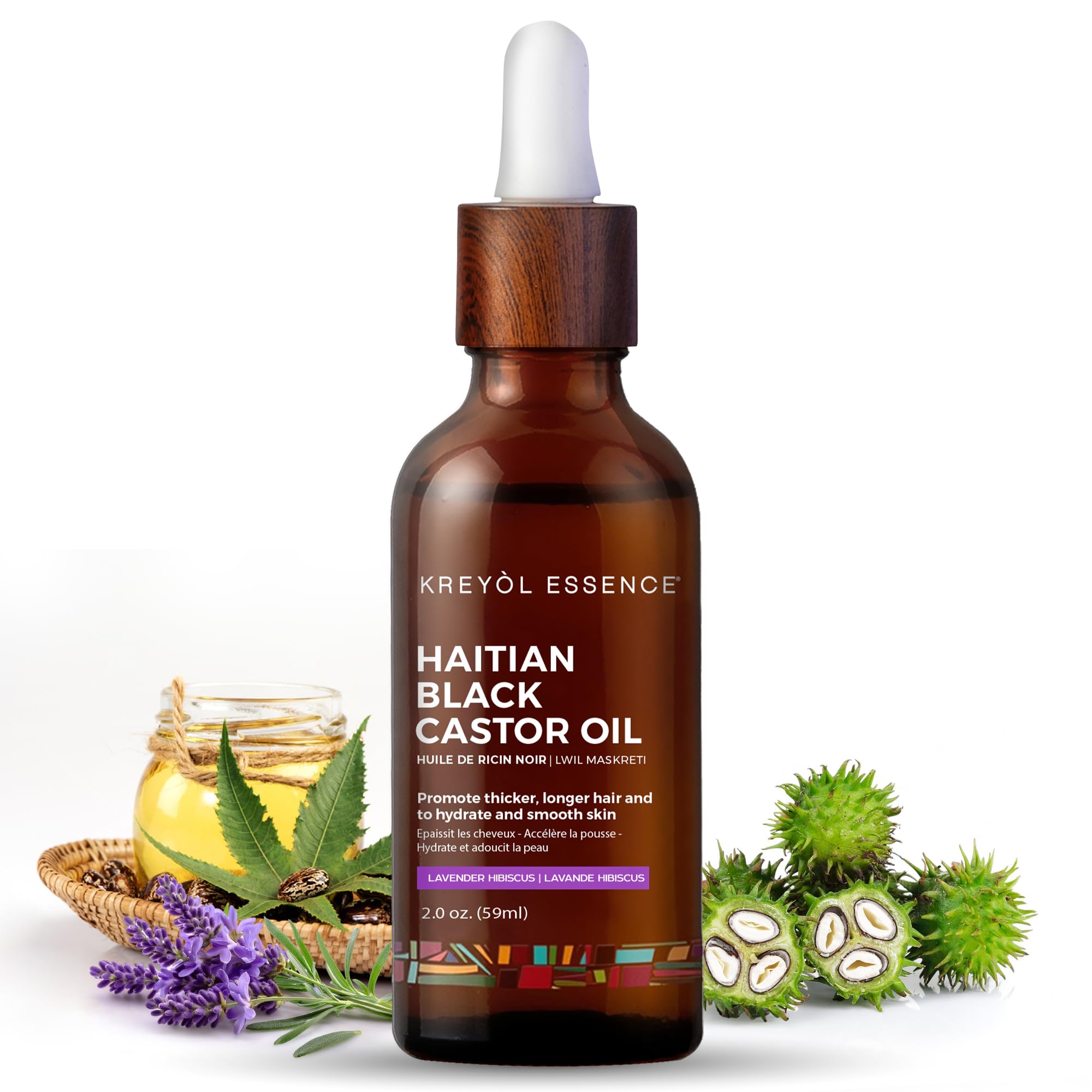 KREYOL ESSENCE Haitian Black Castor Oil bottle with glass packaging for skin and hair care.