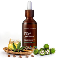 KREYÒL ESSENCE Haitian black castor oil glass bottle showcases rich moisture.