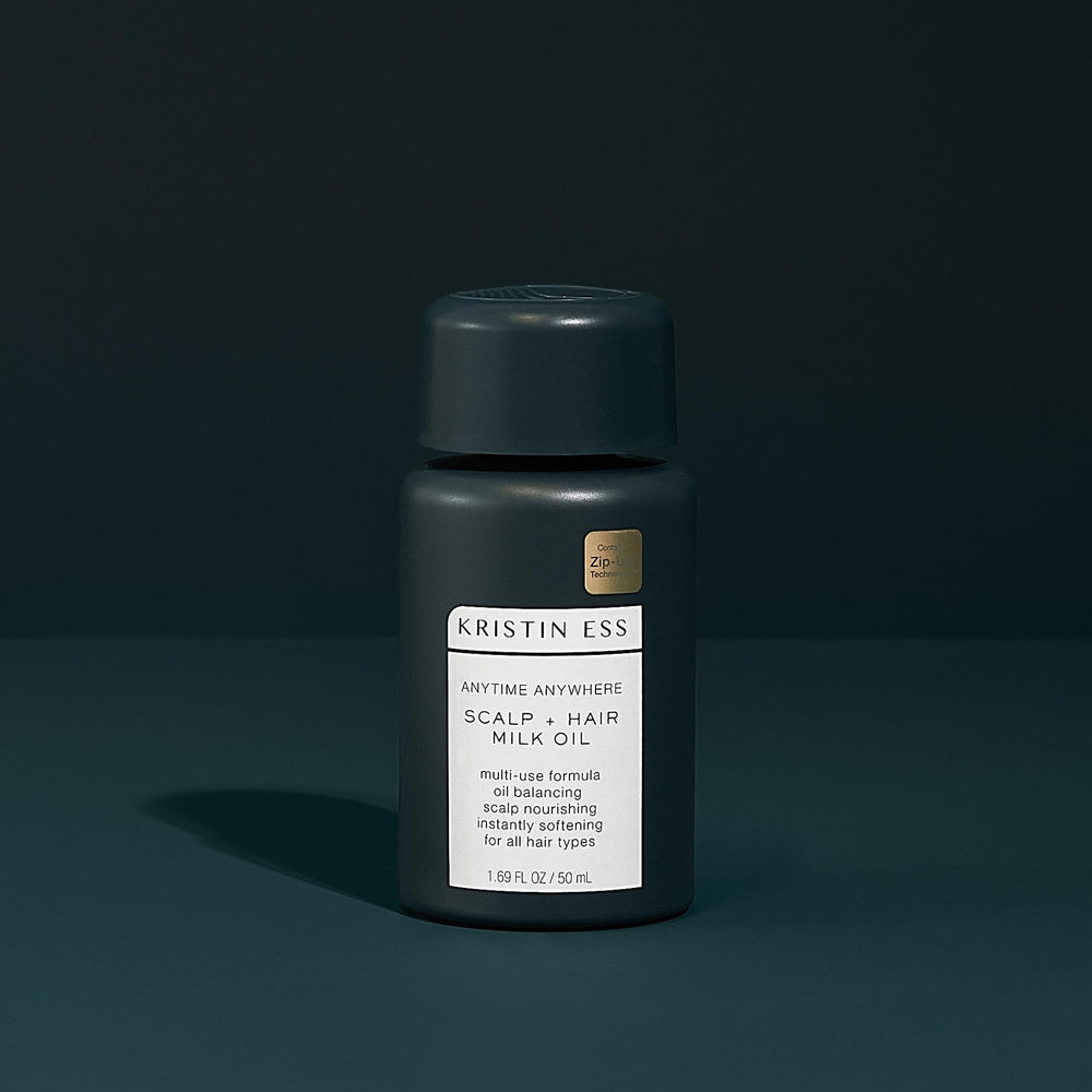 Kristin Ess scalp massage with milk oil delivering soothing nourishment.