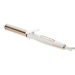 Kristin Ess Hair titanium curling iron barrel creates polished beach waves with added shine.