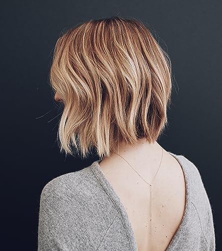 Kristin Ess Hair Refine Signature Finishing Hairspray creates brushable texture without stiffness or crunch
