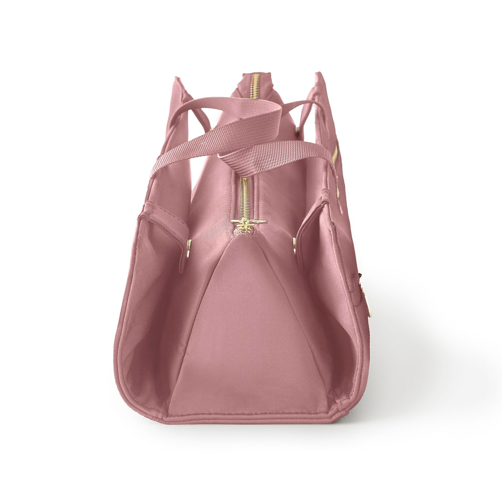 KUSSHI mauve travel bag pictured in-use, ideal for on-the-go styling