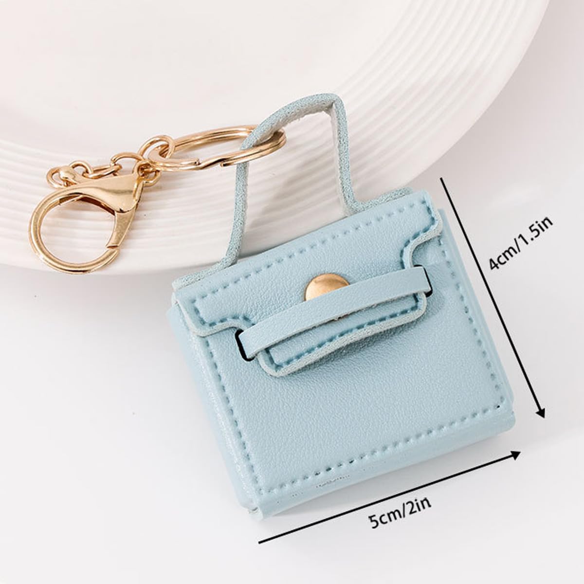 KuuGuu llavero-mochila mini blanco, complemento elegante para bolsos y llaves.