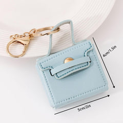 KuuGuu llavero-mochila mini blanco, complemento elegante para bolsos y llaves.