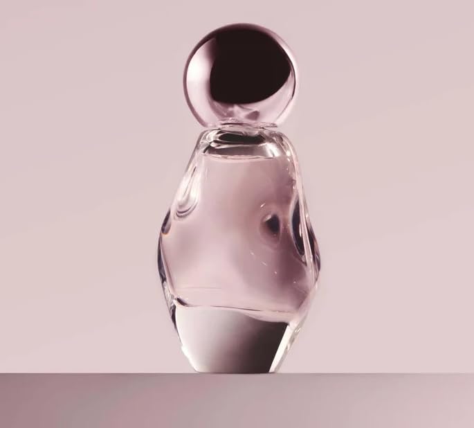 Kylie Cosmetics Cosmic EDP bottle front; ambery floral scent for daily glamour.