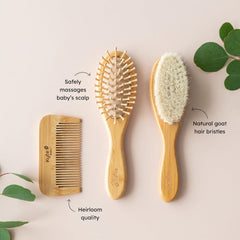 Kyte Baby bamboo 3-piece brush set wooden bristle brush close-up for soft detangling.