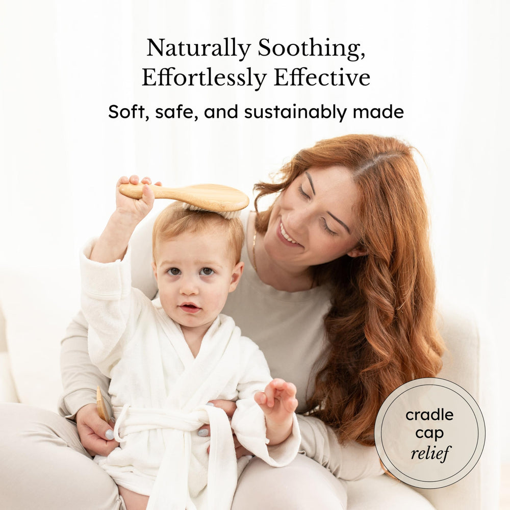Kyte Baby goat hair brush close-up showing soft bristles ideal for cradle cap care.