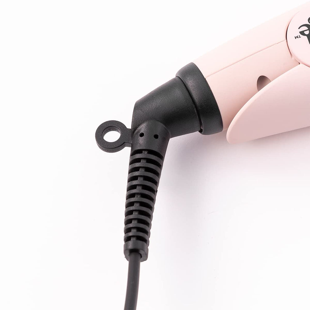 L'ANGE HAIR Le Ceramique 1-Pass Flat Iron in hand for ergonomic styling.