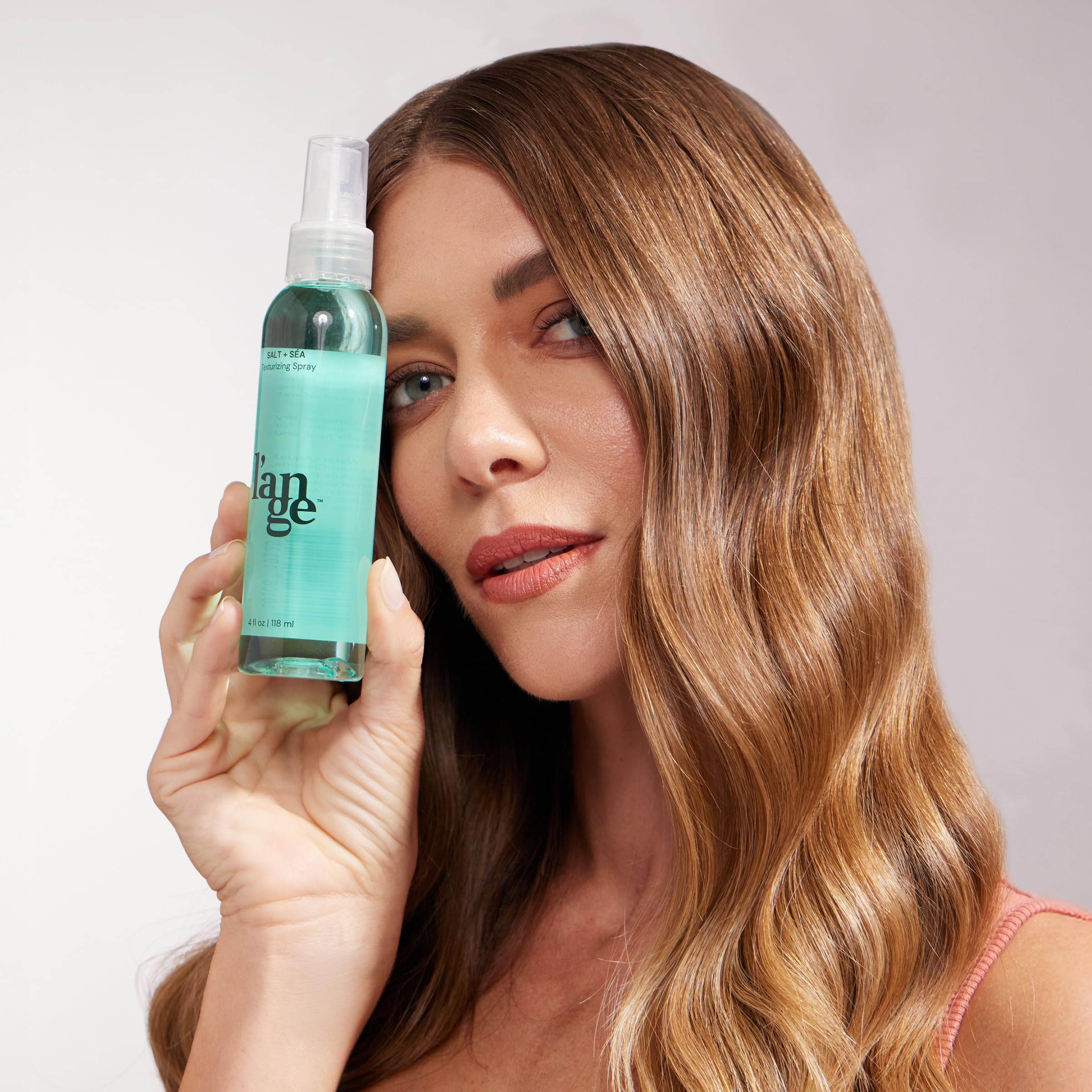 L'ANGE HAIR sea salt texturizing spray demonstrates volume-boosting lift