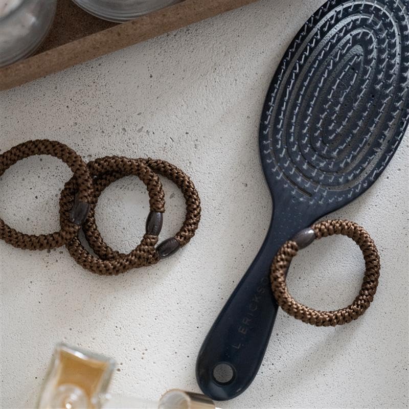 L. Erickson hair ties neutral-tone bead closeup shows polished, secure styling