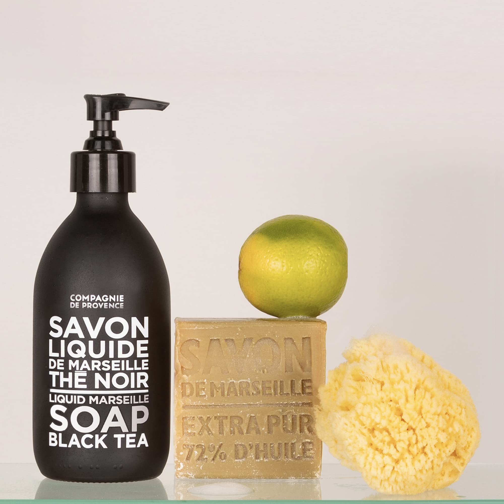 La Compagnie de Provence bathroom setup showing luxurious liquid soap by the sink.
