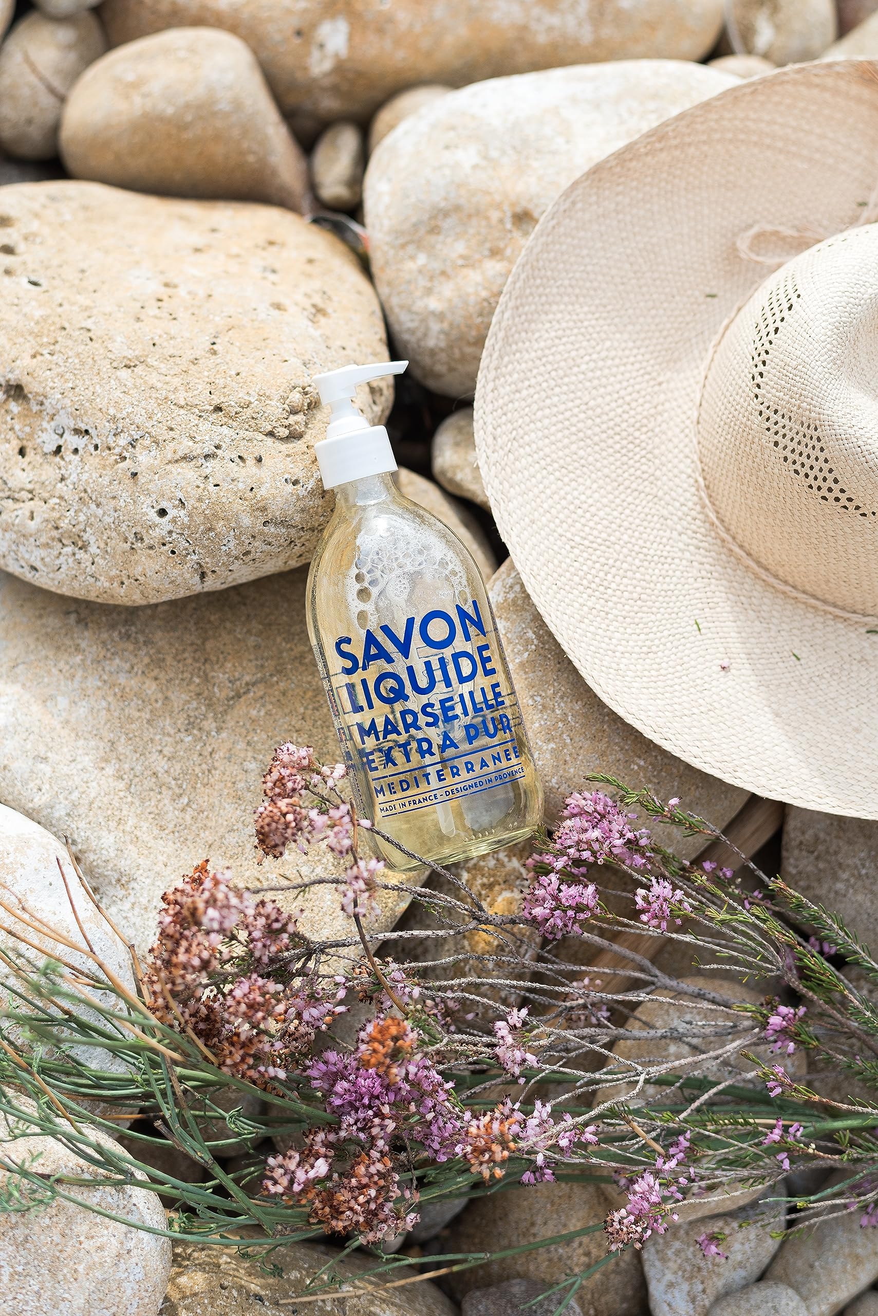 La Compagnie de Provence glass pump bottle showcases refillable design.