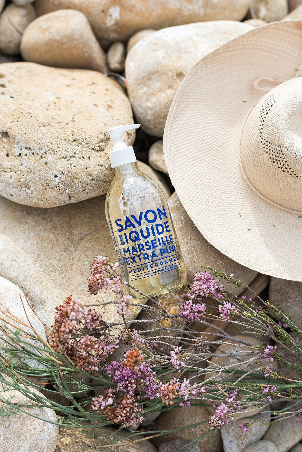 La Compagnie de Provence glass pump bottle showcases refillable design.