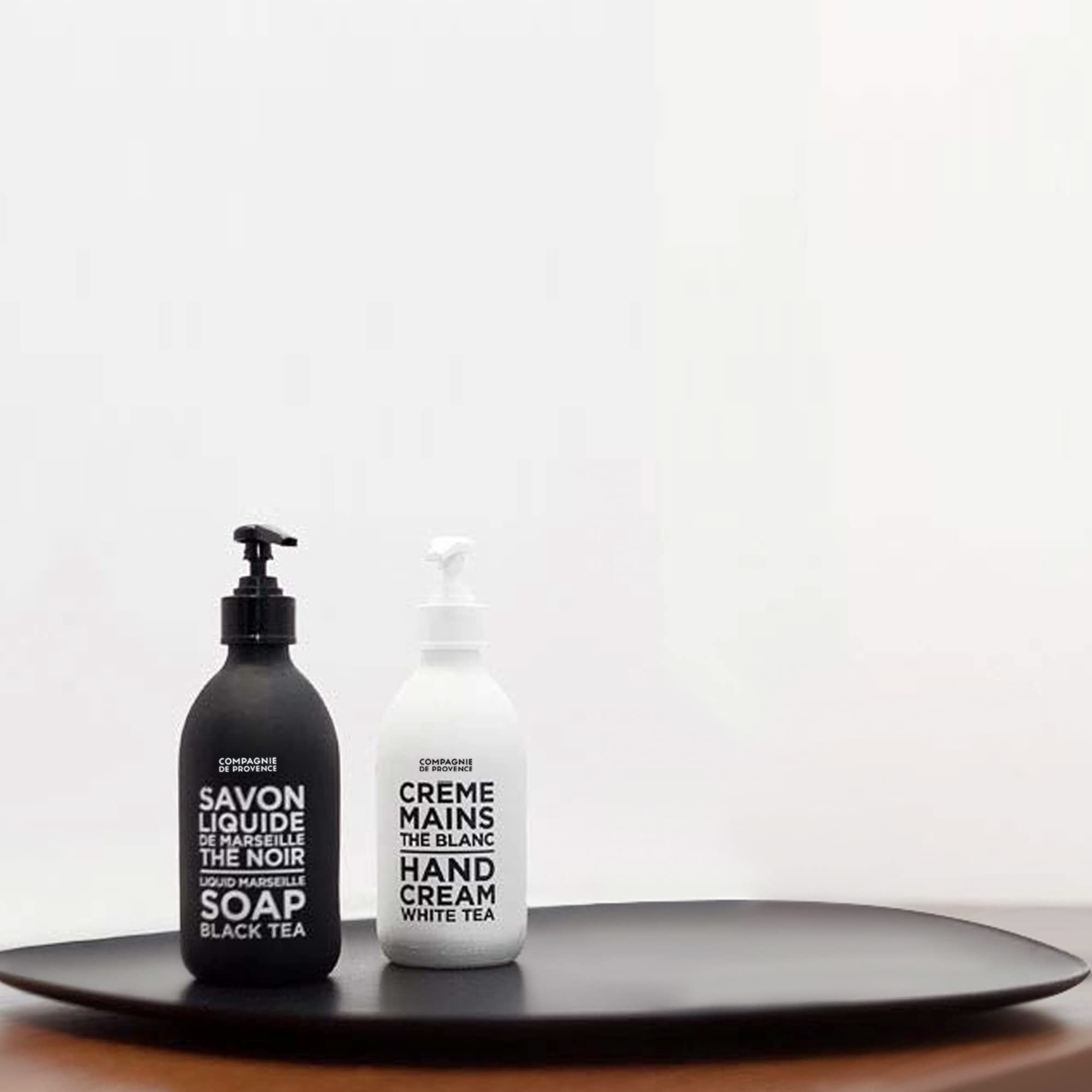 La Compagnie de Provence liquid soap pump closeup highlighting glass bottle and dispenser.