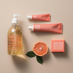 La Compagnie de Provence pink grapefruit fragrance swirl signals a bright, uplifting scent.