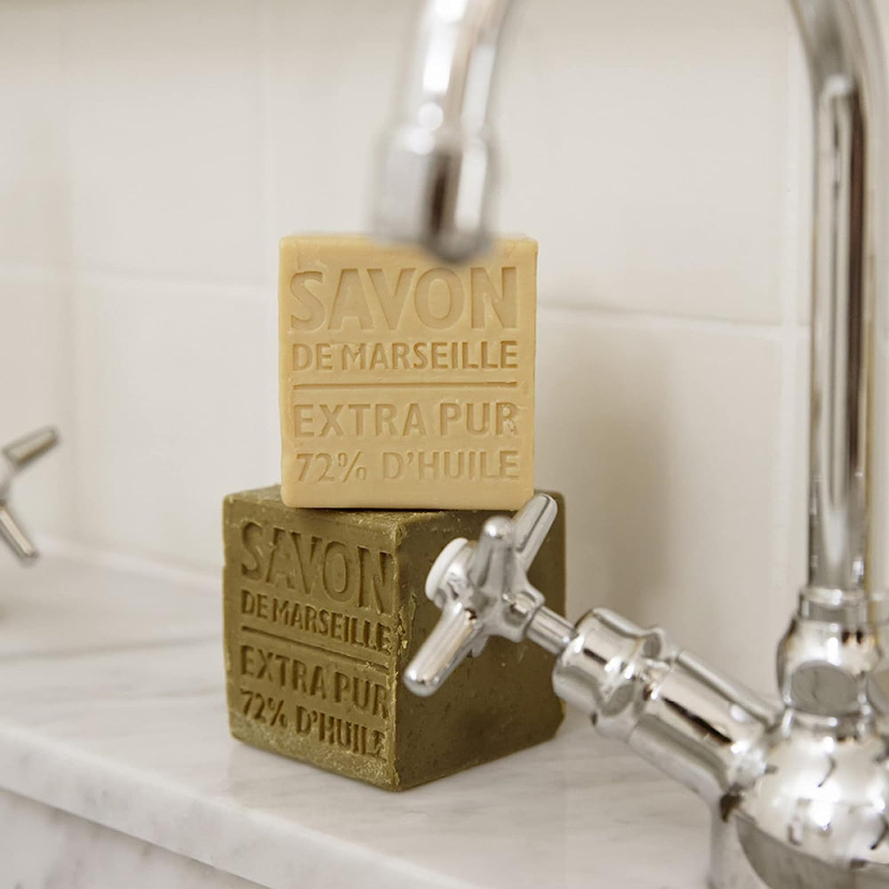 La Compagnie de Provence Palm Soap Cube in hand, versatile for face and body care