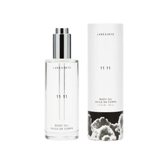 Lake & Skye 11 11 Body Oil bottle close-up for hydrating skin.