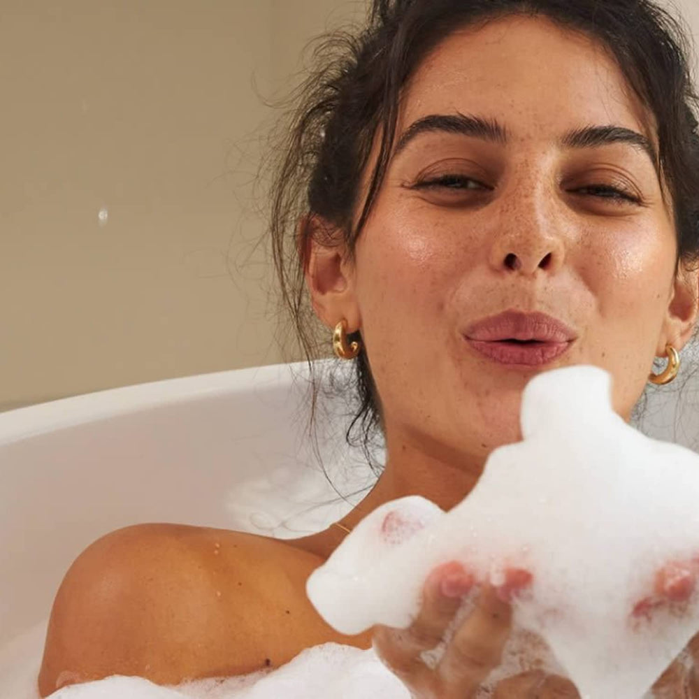 LaLicious Sugar Coconut Sugar Scrub in massage action promoting soft, hydrated skin.