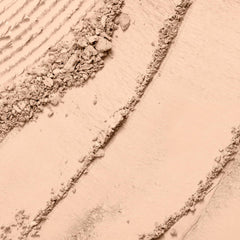 Lancôme Dual Finish Powder Foundation wet-application swatch demonstrates buildable coverage.