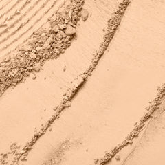 Lancôme Dual Finish wet-application swatch demonstrates a liquid-like finish with powder consistency.