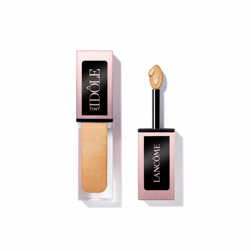 Lancôme Idôle Tint Golden Hour bottle close-up showing iridescent champagne shimmer for a soft glow look