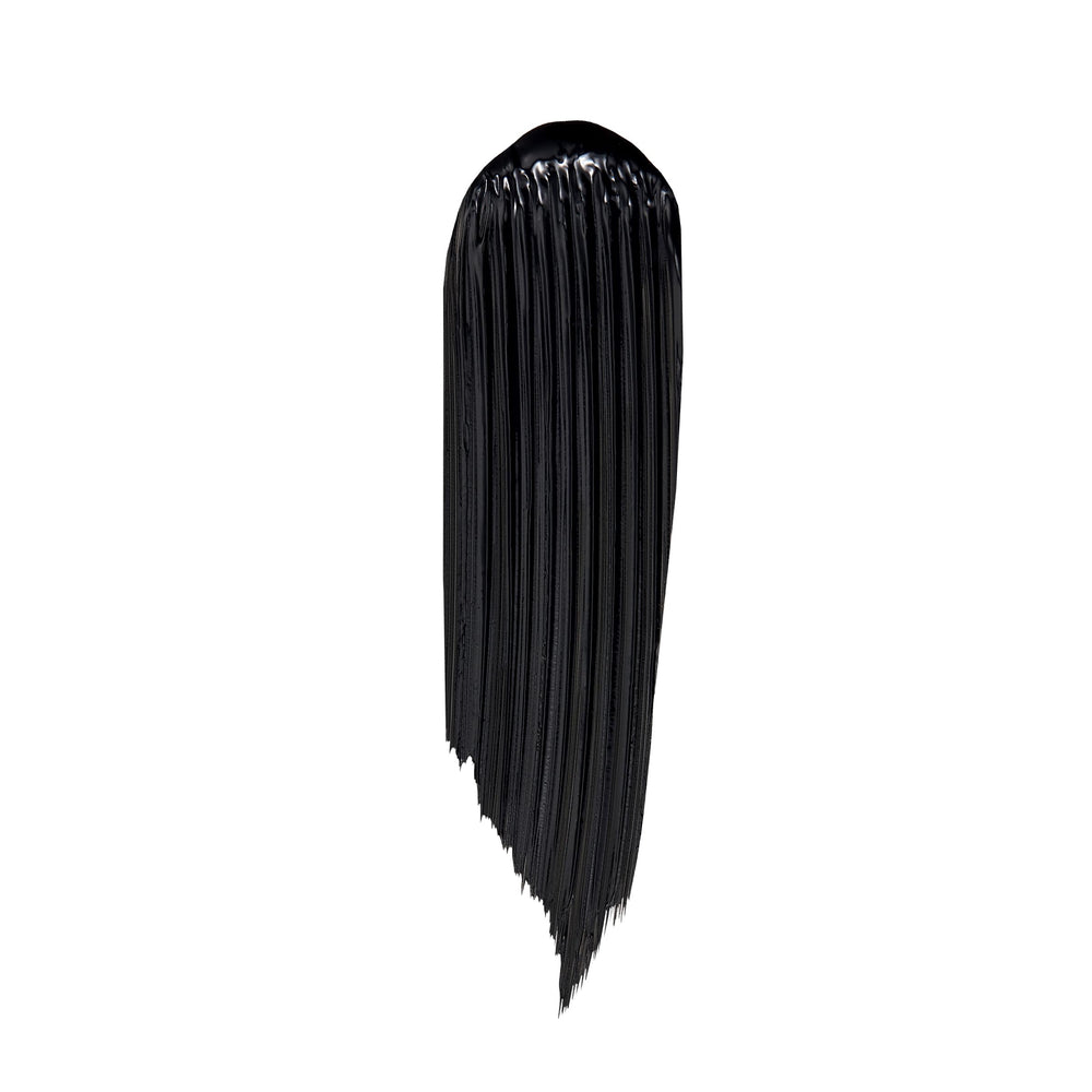 Lancôme Lash Idôle black mascara cap close-up with bold branding.
