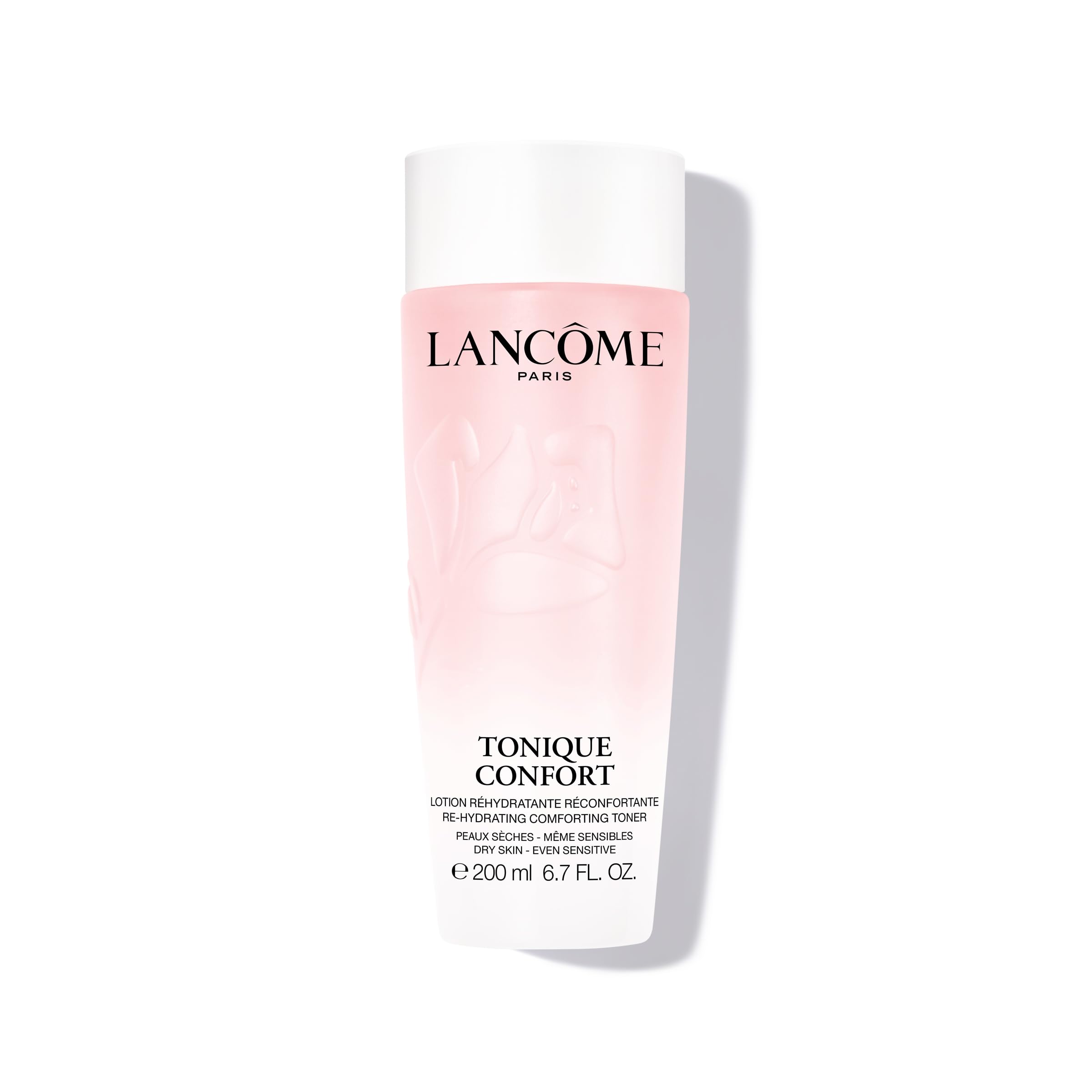 Lancôme Tonique Confort bottle close-up shows hydrating milky texture for daily comfort.
