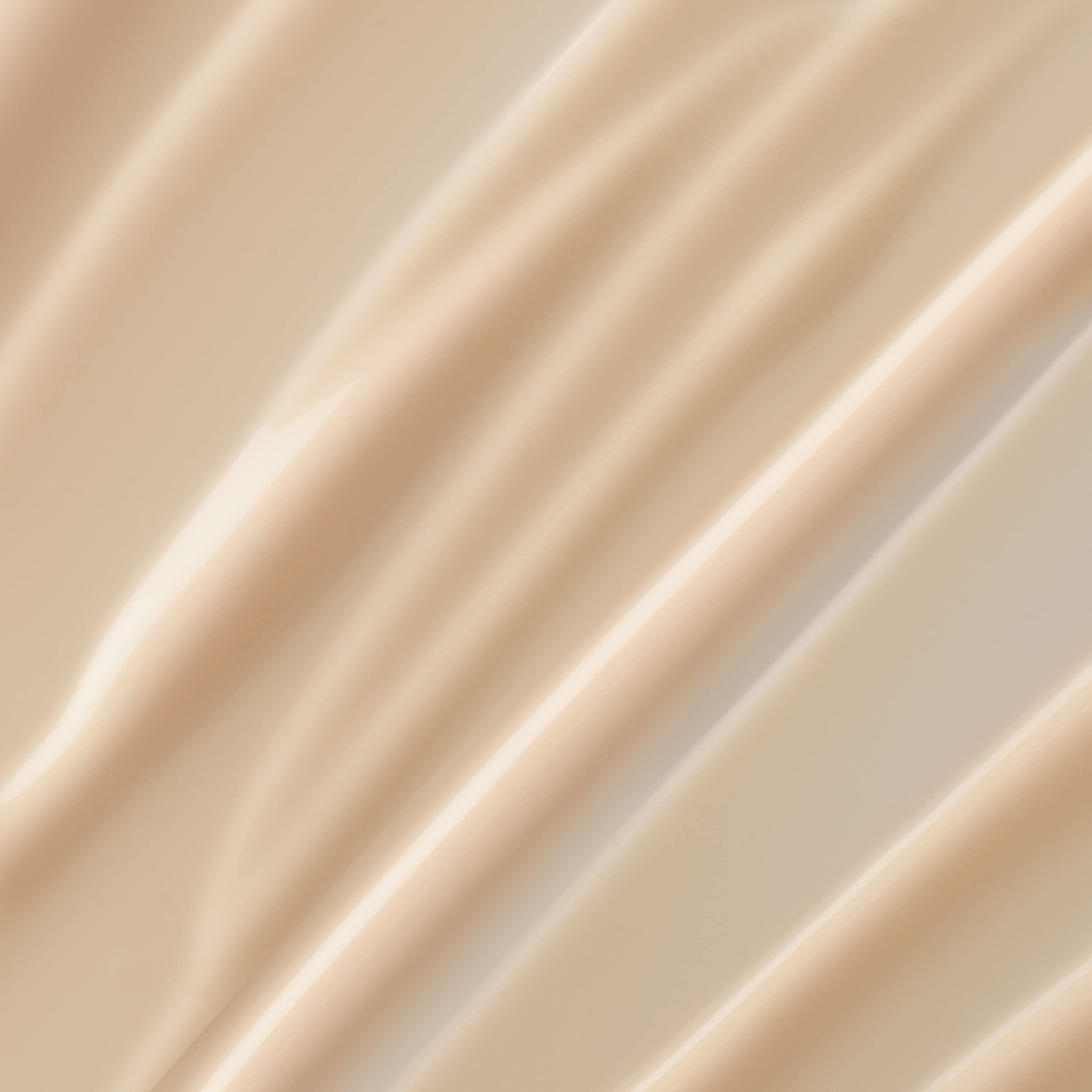 Lancôme Trésor scented body lotion texture closeup highlights a lightweight, fast-absorbing formula.