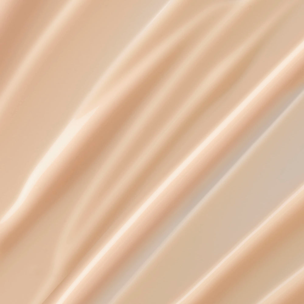Lancôme Trésor scented body lotion texture closeup highlights a lightweight, fast-absorbing formula.