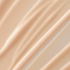 Lancôme Trésor scented body lotion texture closeup highlights a lightweight, fast-absorbing formula.