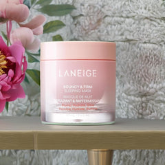 LANEIGE applying mask to cheek to demonstrate overnight treatment benefit