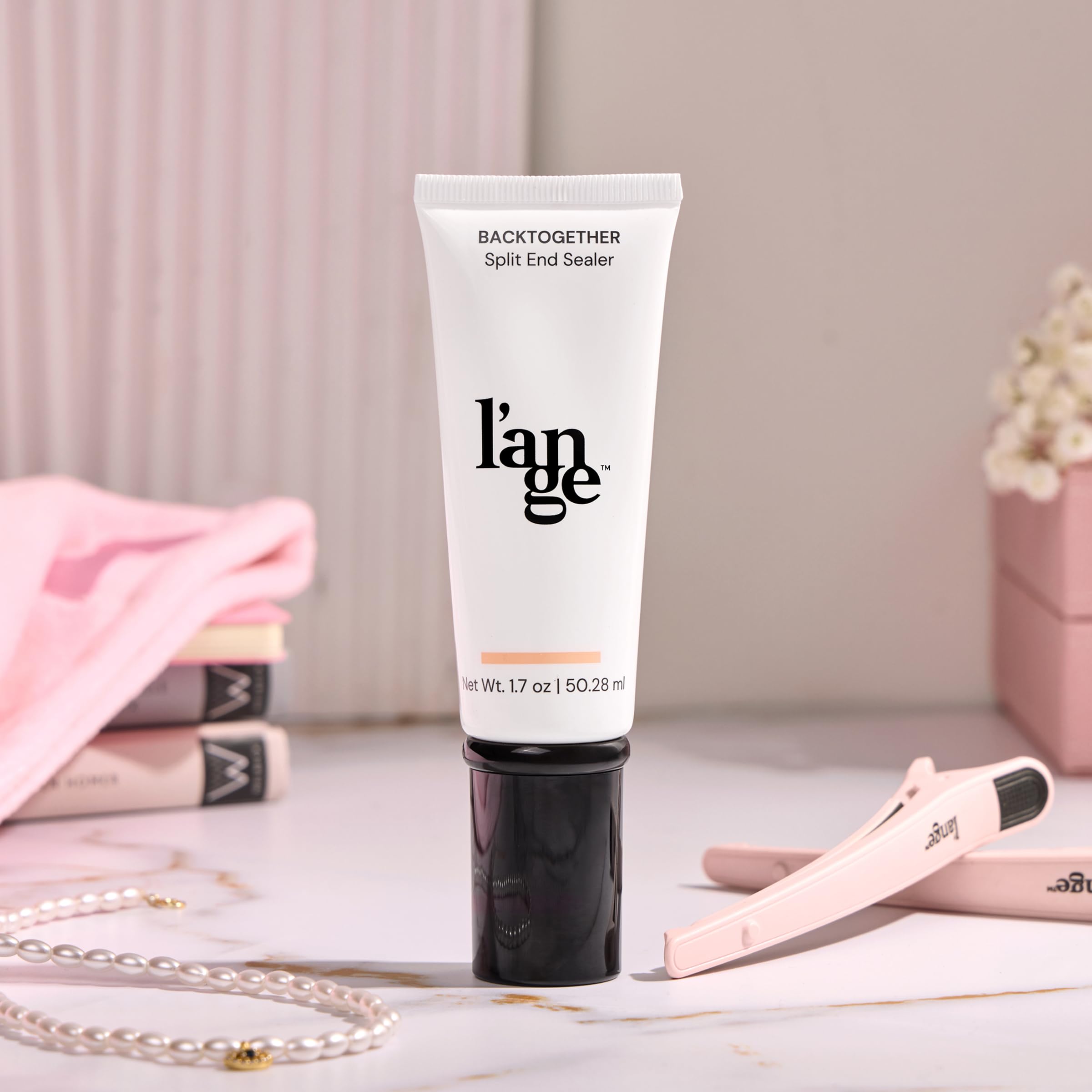 L'ANGE HAIR BackTogether on a shelf showing travel-friendly, compact packaging for maintenance.