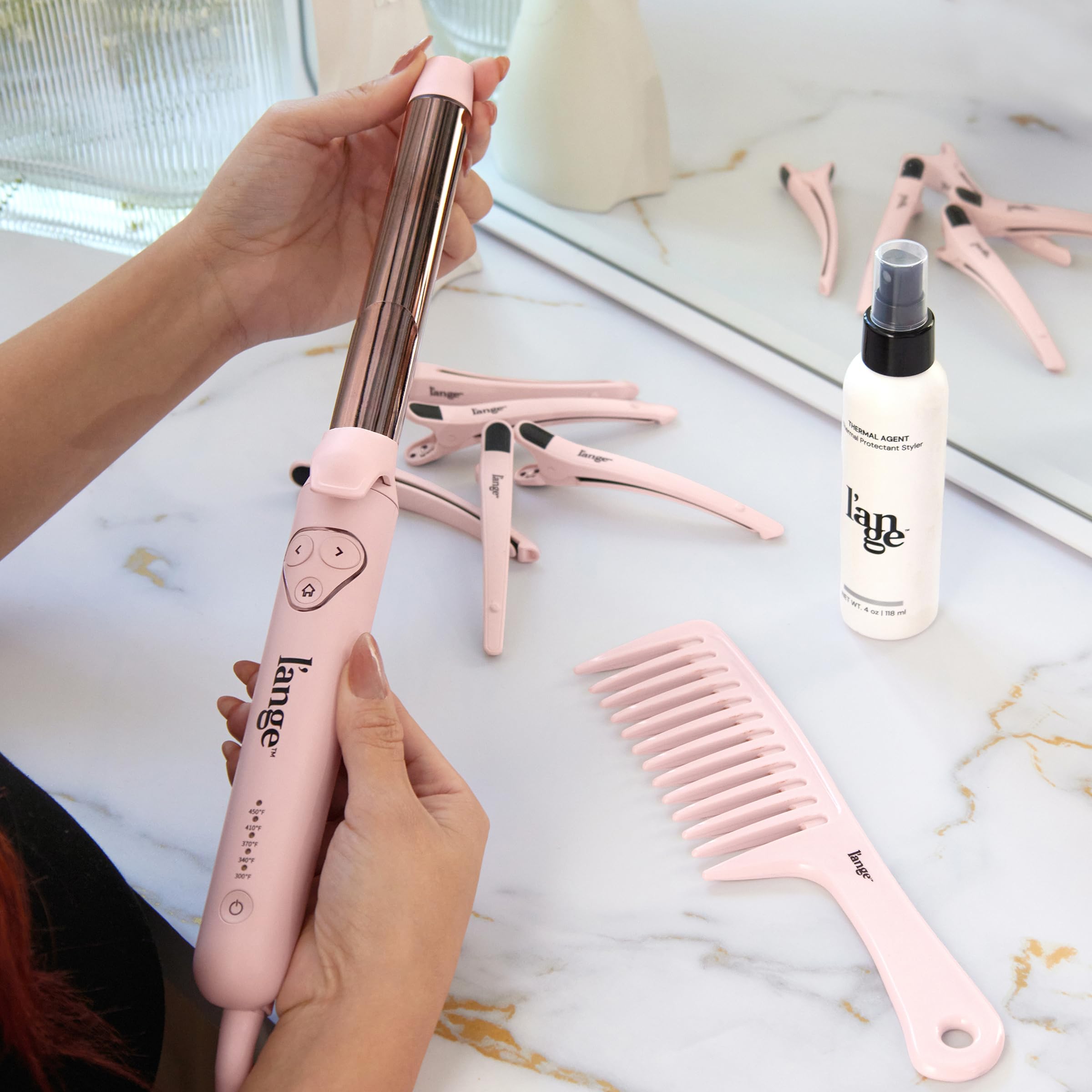L'ANGE HAIR Le Pirouette in action capturing easy curling and smooth waves.