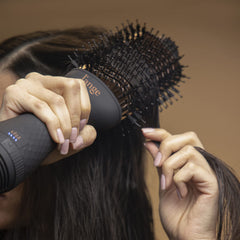 L'ANGE HAIR Le Volume 60mm oval barrel delivers smooth, frizz-controlled blowouts.