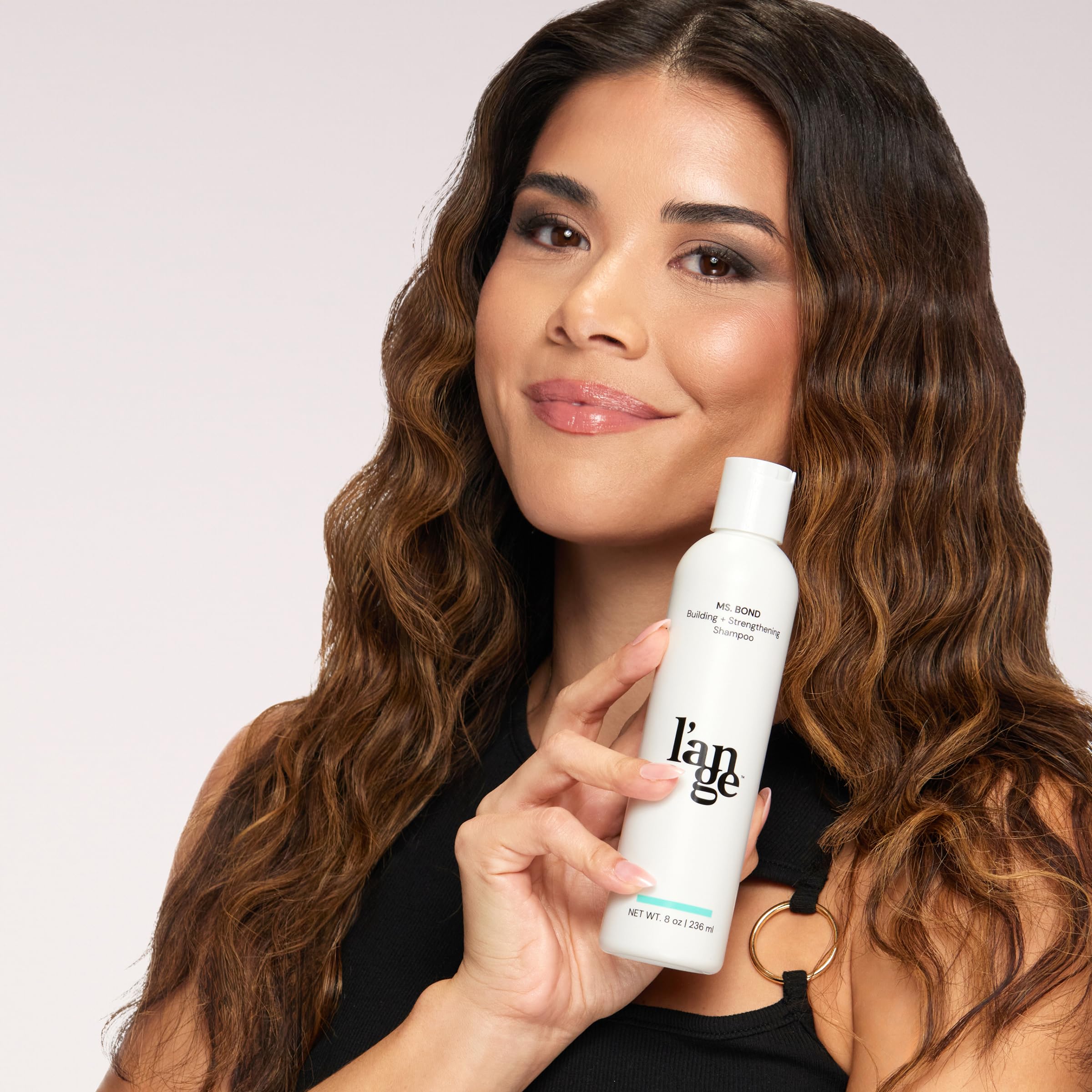 L'ANGE HAIR Ms. Bond Shampoo travel-friendly packaging demonstrates on-the-go bond care.