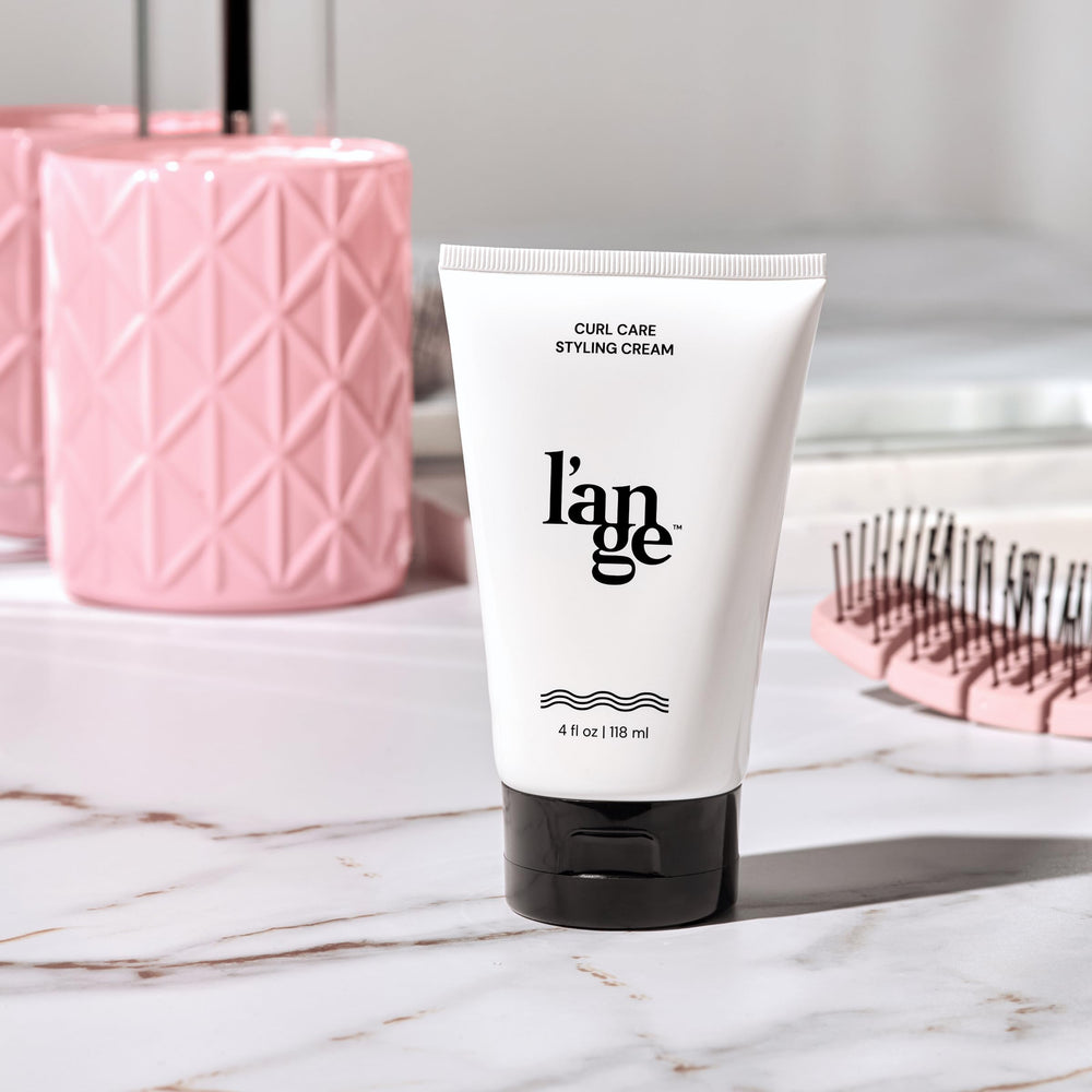Frizz-free curls with L'ANGE Hair Styling Cream for lasting bounce.
