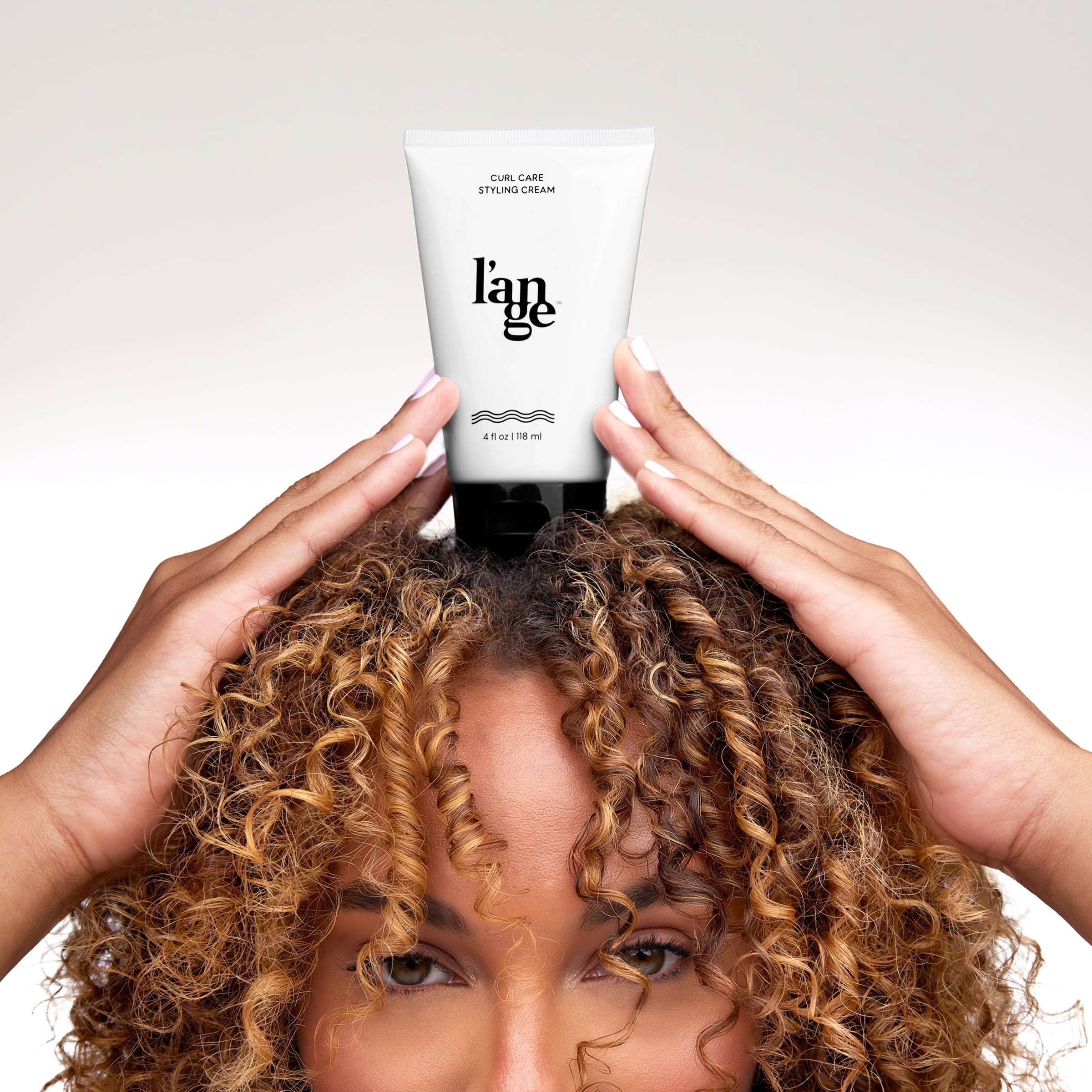 L'ANGE Hair Styling Cream texture close-up showing creamy velvety finish for smooth curls.