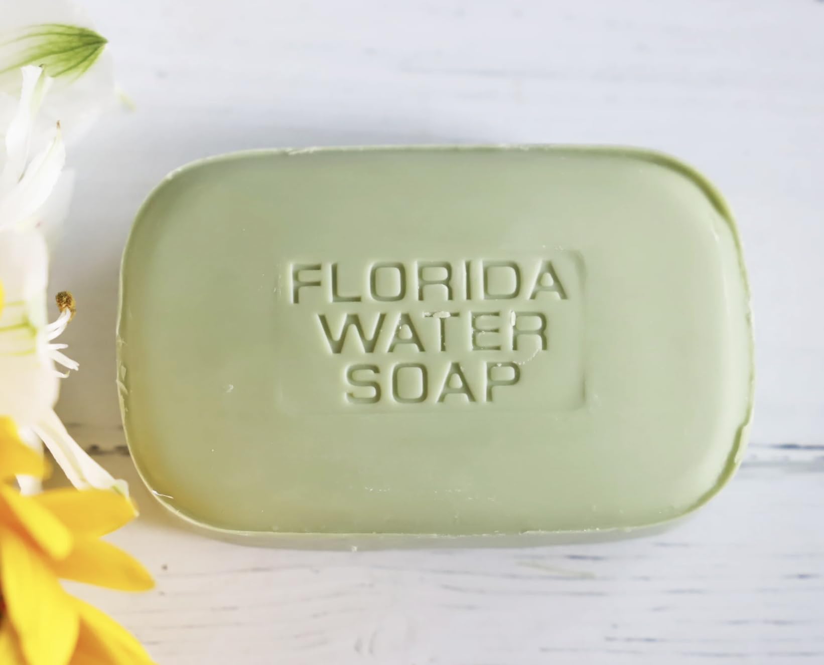 Lanman & Kemp Florida Water soap bar in hand showing rich lather and refreshing scent.