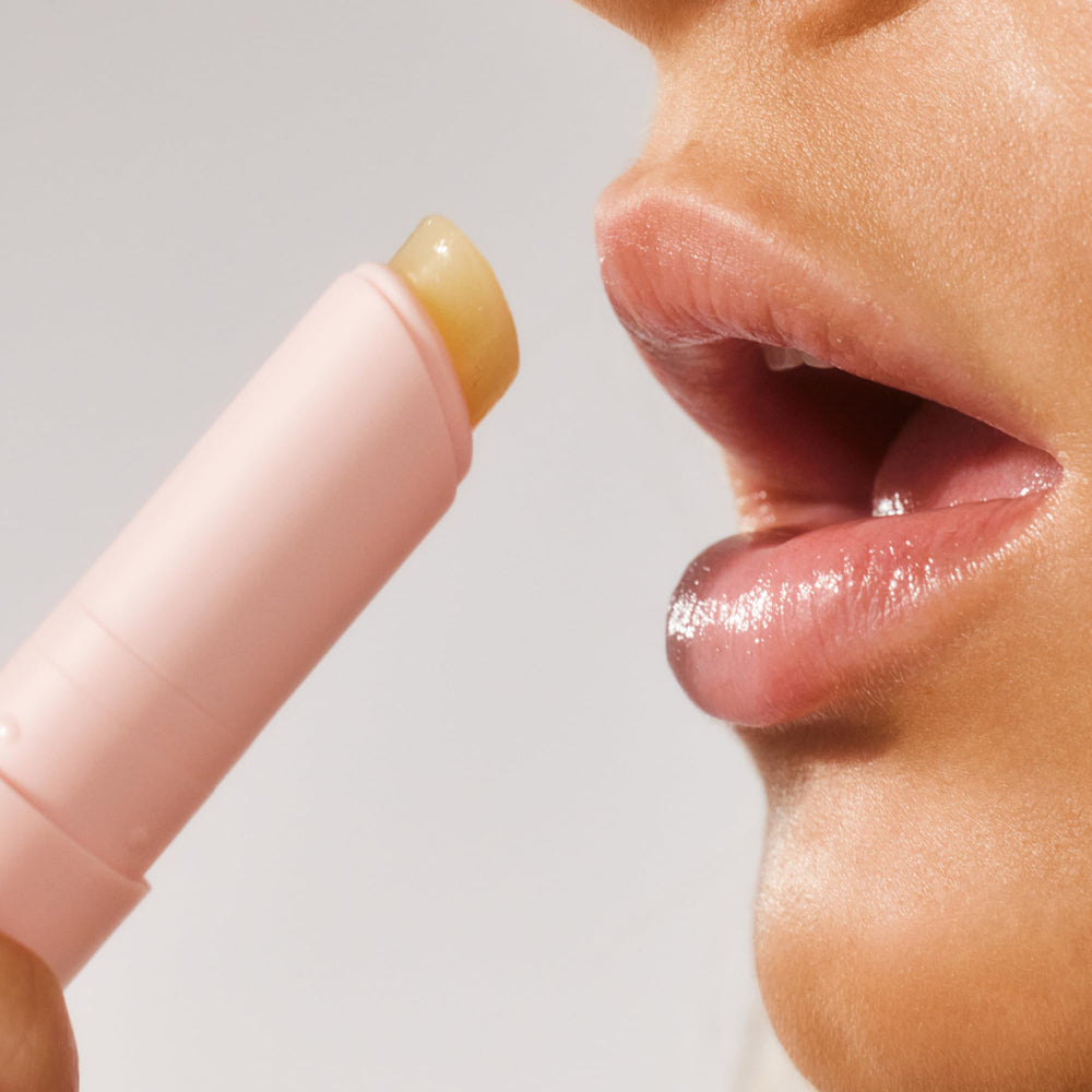 Lanolips Lanostick ingredients montage featuring lanolin, castor oil, jojoba oil, and shea butter