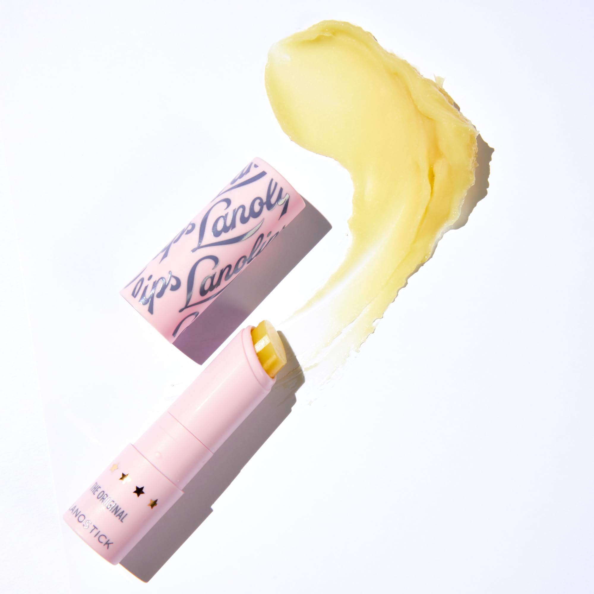 Lanolips Lanostick packaging front shows compact lip care in a sleek stick