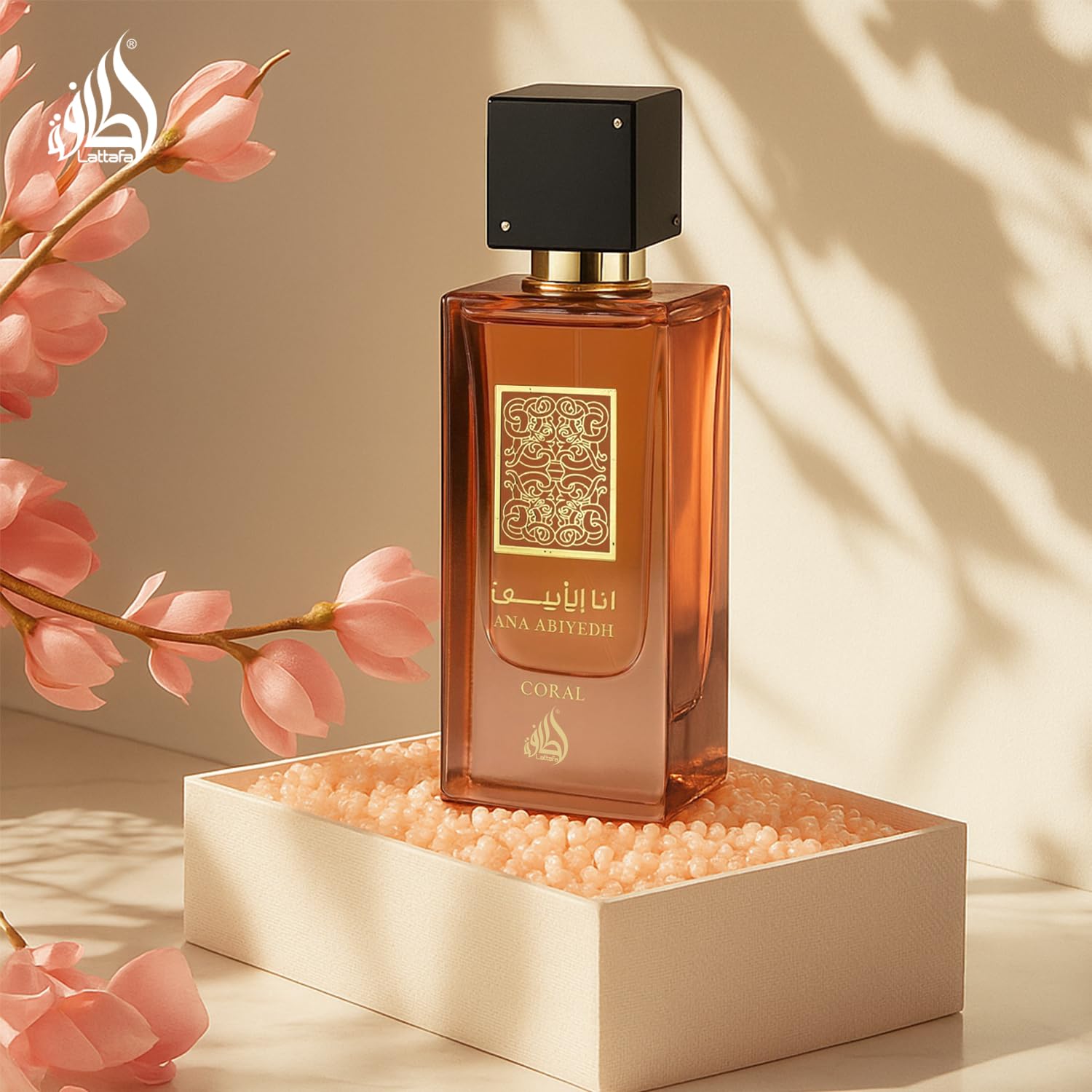 Lattafa Ana Abiyedh Coral on a vanity table conveys premium fragrance experience
