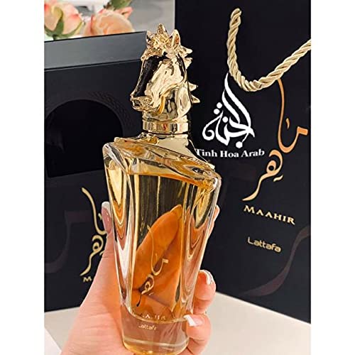 Lattafa Maahir peach-bellini top-note image evokes summery zest and social confidence.