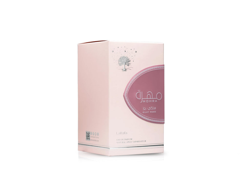 Lattafa Mohra Silky Rose lifestyle shot of applying perfume for elegance