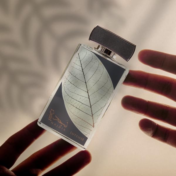 Lattafa Najdia Intense bottle closeup highlights citrus-woody notes for confident presence.
