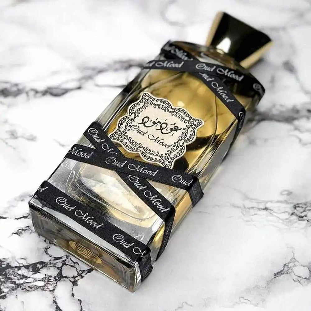Lattafa Oud Mood cap closeup highlights sleek luxury design